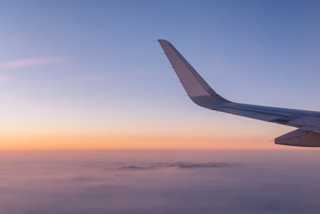Airplane Wing in the Sky Photo for Aviation Service
