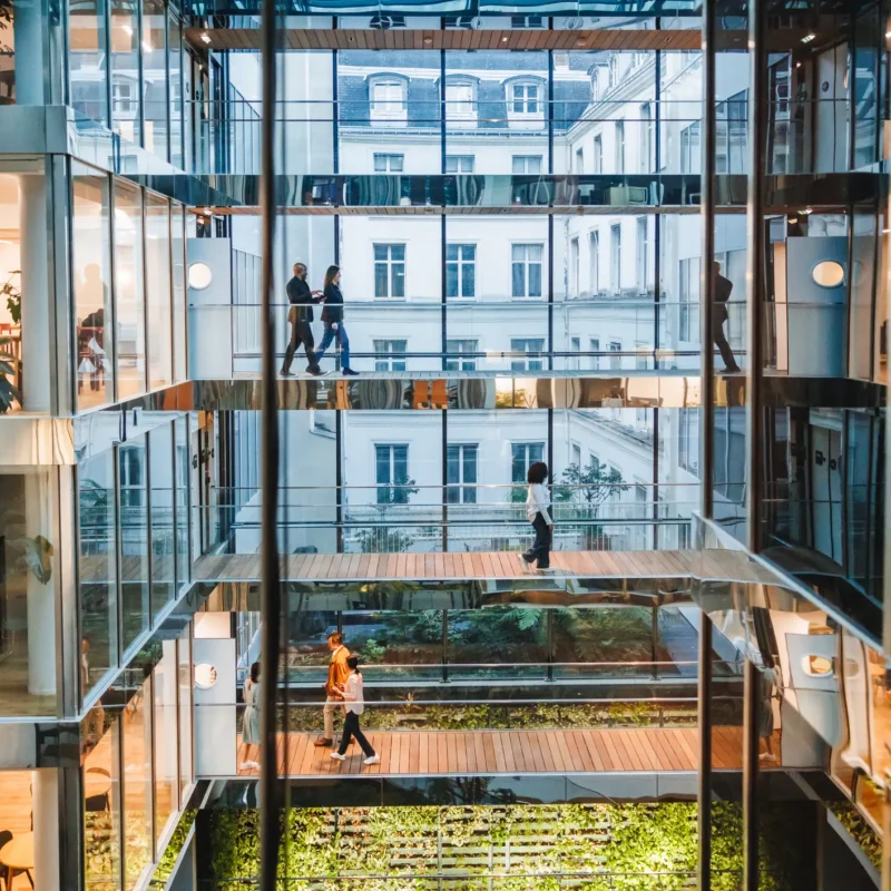 Modern office building with people passing by photo for Labor & Employment Service
